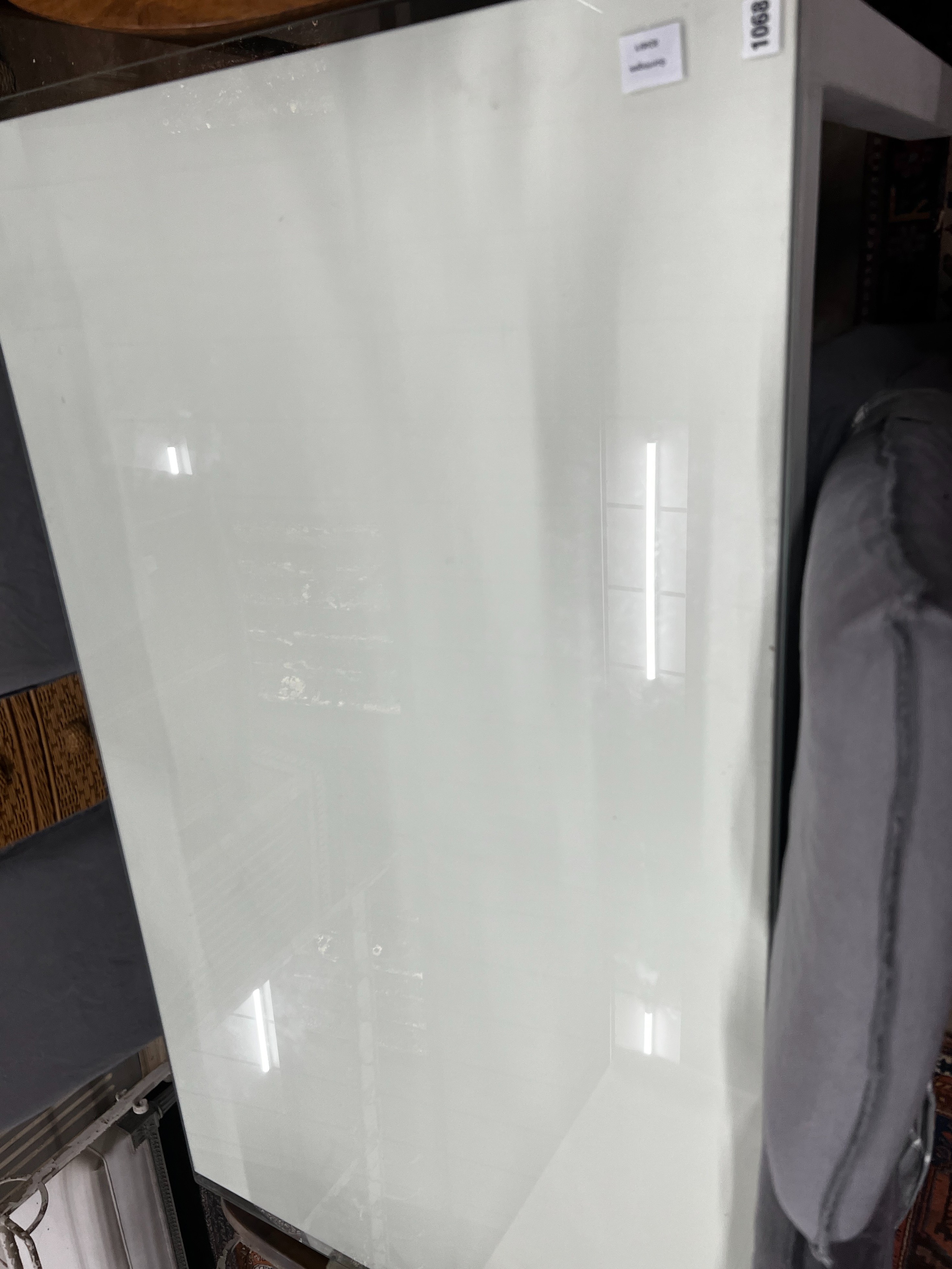 A contemporary rectangular dining table, length 140cm, width 84cm, height 75cm and four linen covered chairs *Please note the sale commences at 9am.